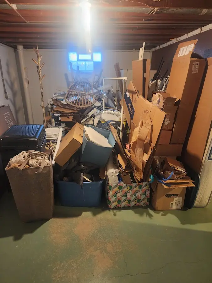 Roll-off dumpster container at job site for 2 Yard Dumpster Rental in Castleton